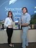 Structural Graphics' Gina Block, creative brand manager and Erik Hluchan, creative director with the award winning pieces.